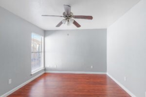 Bedrooms with wood flooring in our apartments for rent at any of the falls apartments location in Houston, TX.